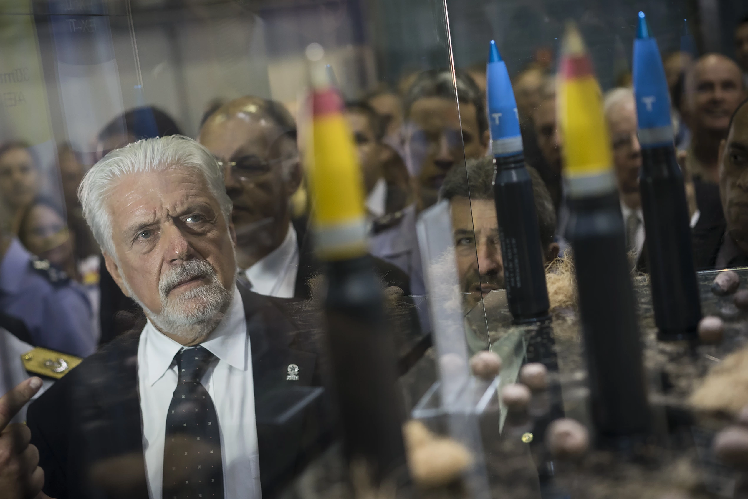 Brazil's Defense Minister Jaques Wagner looks at ammunition as he tours the LAAD Defense and Security International Exhibition in Rio de Janeiro, Brazil, Tuesday, April 14, 2015. (AP Photo/Felipe Dana)