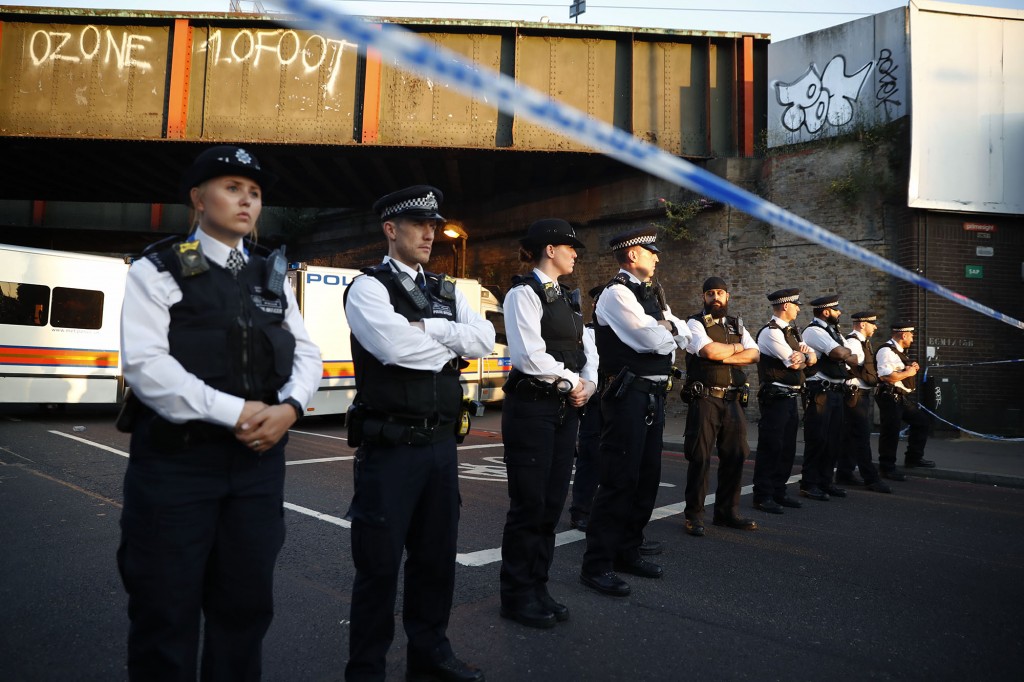 Police man a cordon at the scene in the Finsbury Park area of north London after a vehichle hit pedestrians, on June 19, 2017. One man was killed and eight people hospitalised when a van ran into pedestrians near a mosque in north London in an incident that is being investigated by counter-terrorism officers, police said on Monday. The 48-year-old male driver of the van "was found detained by members of the public at the scene and then arrested by police," a police statement said. / AFP PHOTO / Tolga AKMEN (Photo credit should read TOLGA AKMEN/AFP/Getty Images)