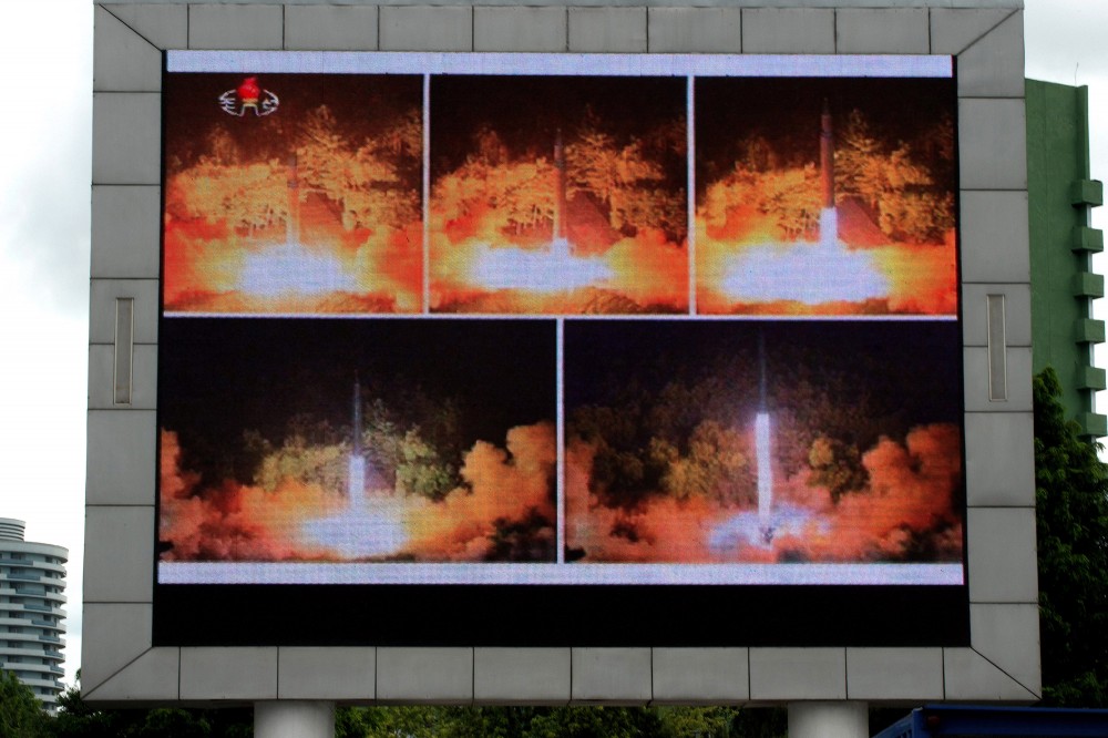 Coverage of an ICBM missile test is displayed on a screen in a public square in Pyongyang on July 29, 2017.Kim Jong-Un boasted of North Korea's ability to strike any target in the US after a second ICBM test that weapons experts said on July 29 could even bring New York into range - in a potent challenge to President Donald Trump. / AFP PHOTO / Kim Won-Jin (Photo credit should read KIM WON-JIN/AFP/Getty Images)