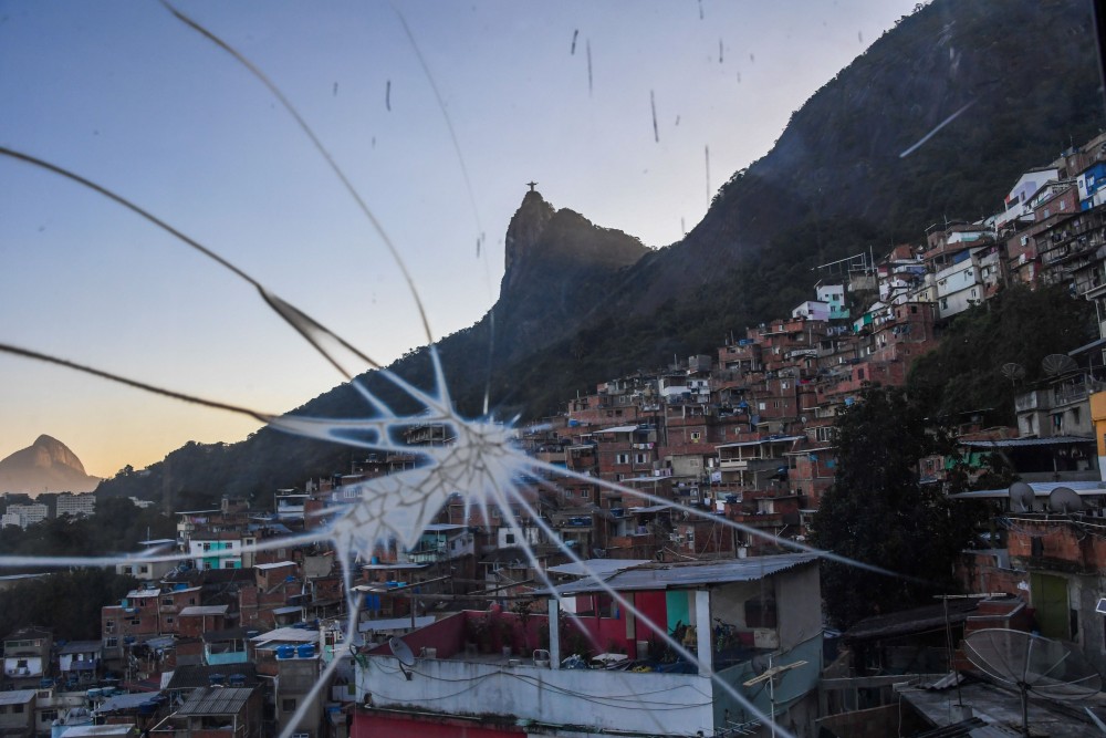 View from the elevator "Plano Inclinado" at the Santa Marta favela, the first to be pacified by the Pacifier Police Unit (Unidade Pacificadora da Policia, UPP) state programme to secure poor communities by forcing drug traffickers out of shantytowns, in Rio de Janeiro, Brazil, on September 12, 2017.In 2010, Santa Marta had become a symbol of a new police policy known as "pacification" that ousted traffickers and brought in tourists, but in the wake of the 2016 Rio Olympics, control over the favelas has again begun to slip away from the police and into the hands of well-armed drug gangs. / AFP PHOTO / Apu Gomes (Photo credit should read APU GOMES/AFP/Getty Images)