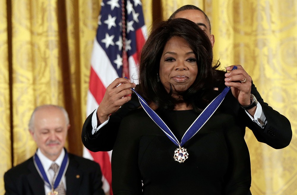 WASHINGTON, DC - NOVEMBER 20: U.S. President Barack Obama awards the Presidential Medal of Freedom to Oprah Winfrey in the East Room at the White House on November 20, 2013 in Washington, DC. The Presidential Medal of Freedom is the nation's highest civilian honor, presented to individuals who have made meritorious contributions to the security or national interests of the United States, to world peace, or to cultural or other significant public or private endeavors. Also pictured is Mario Molina (L). (Photo by Win McNamee/Getty Images)