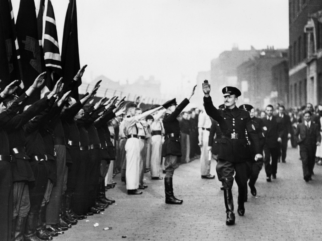 4th October 1936: British politician Sir Oswald Ernald Mosley (1896 - 1980) inspects members of his British Union of Fascists in Royal Mint Street, London. Their presence sparked a riot which became known as the Battle of Cable Street. (Photo by Central Press/Getty Images)