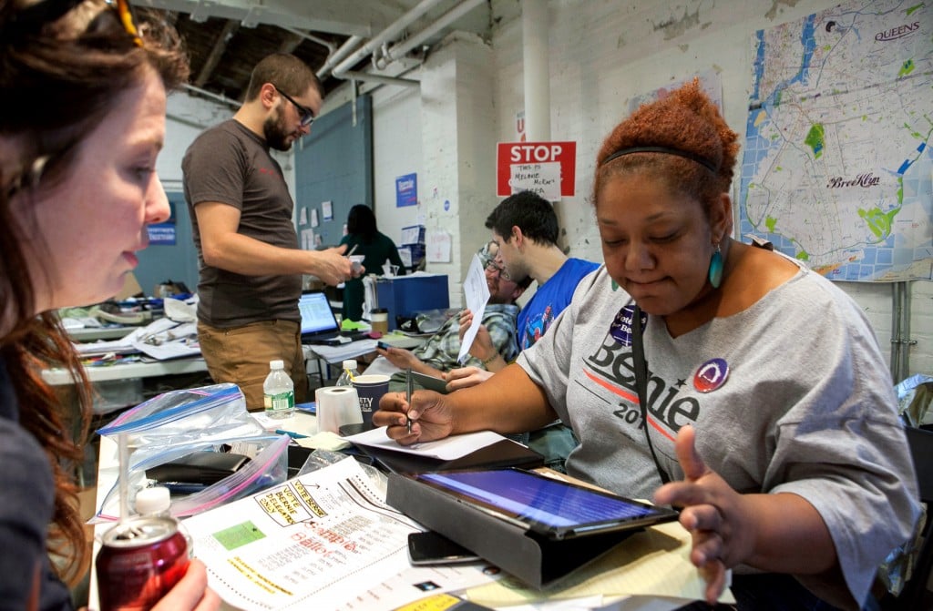 Staffer Melanie (right) helps volunteers at the NY State Bernie Sanders headquarters in the neighborhood of Gowanus in Brooklyn, NY on the 19th of April, 2016. This is the date of NY State primaries for both the Democratic and the Republican parties in order to select their candidates for the US presidential election of the upcoming November. Photo by: Alessandro Vecchi/picture-alliance/dpa/AP Images