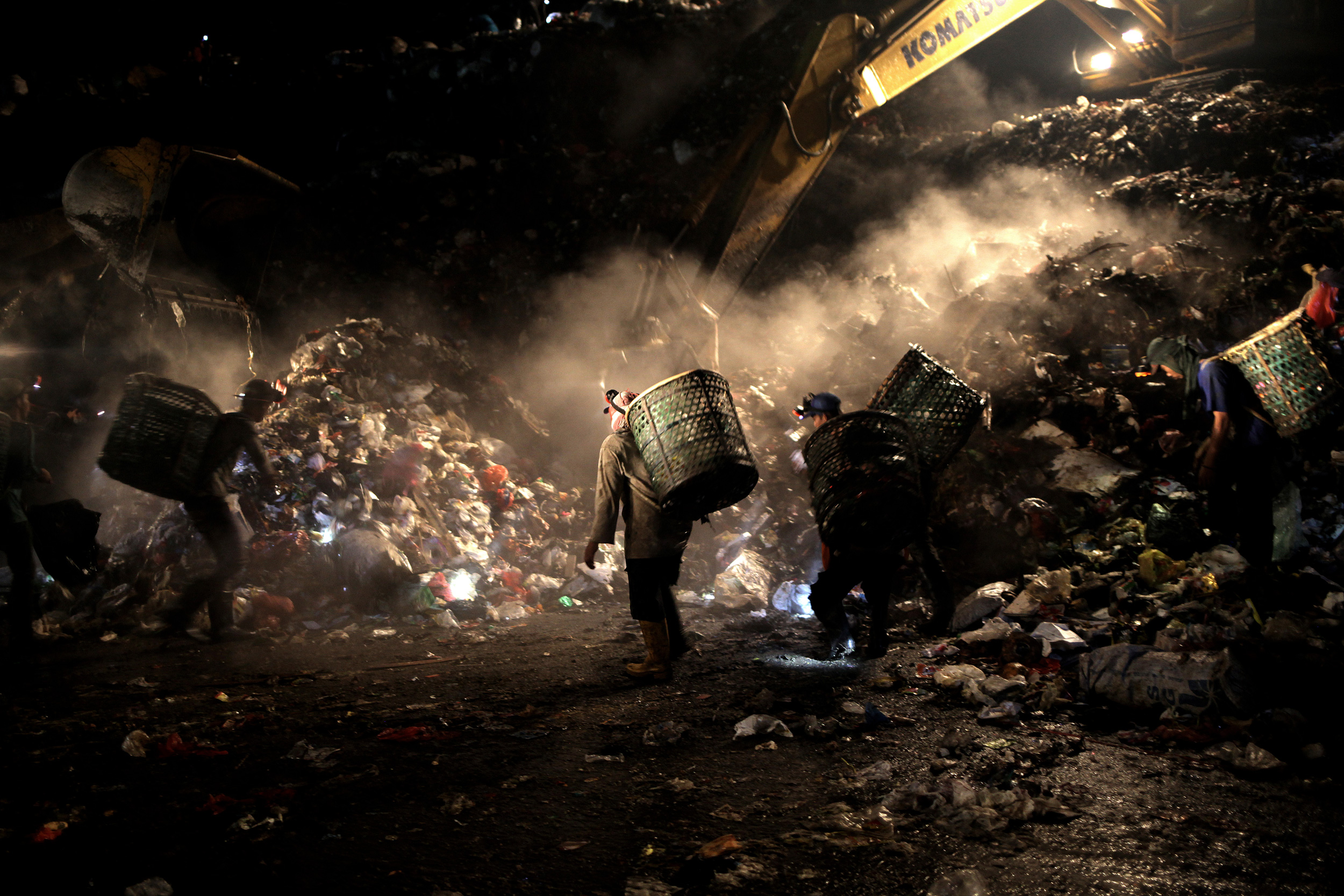 Scavengers working amidst a leak of methane gas at the Bantar Gebang landfill in Jakarta, Indonesia, on March 23, 2017.